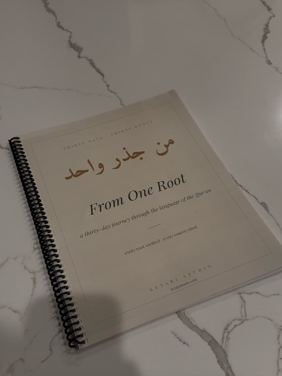 A real coil-bound copy of the From One Root journal